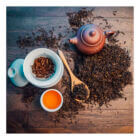 Western Immortal - Organic Lapsang Souchong tea in a cup with loose tea on a table| Be So Well