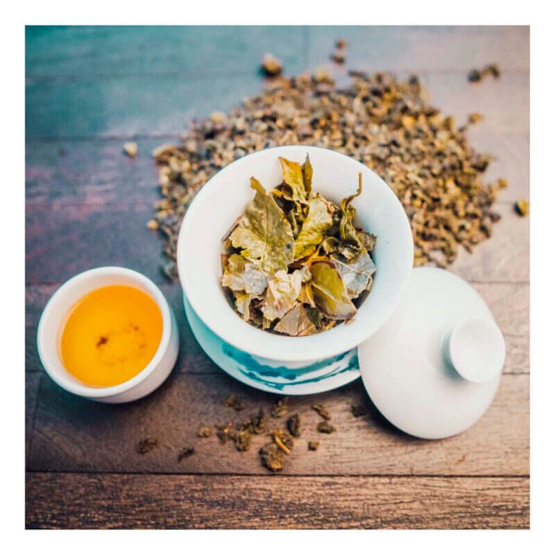 Western Immortal - Organic Ti Kuan Yin tea in a tea cup with loose tea | Be So Well